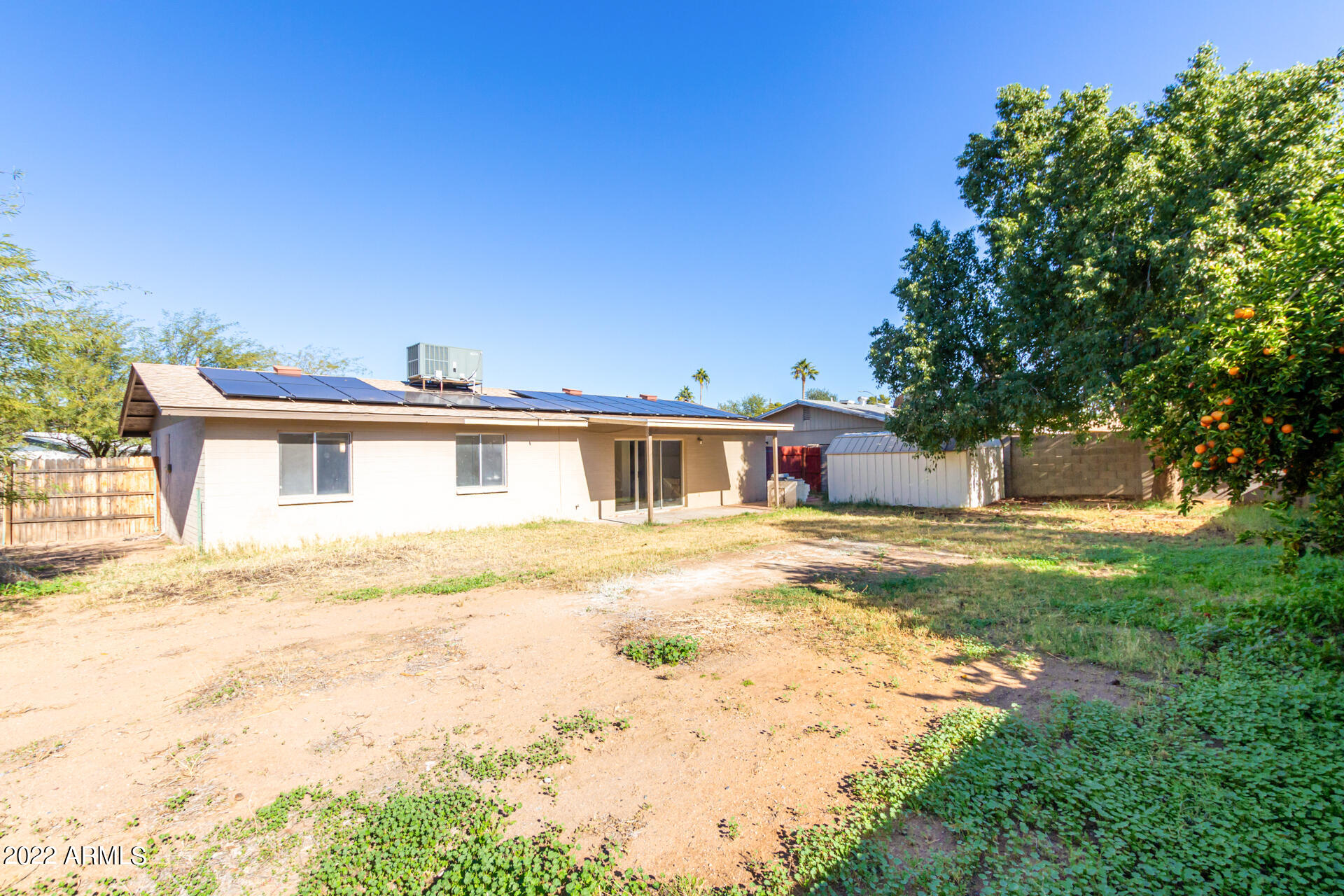 1225 West Halstead Drive Phoenix, AZ 85023 - Photo 16 of 19 a front view of a house with a yard