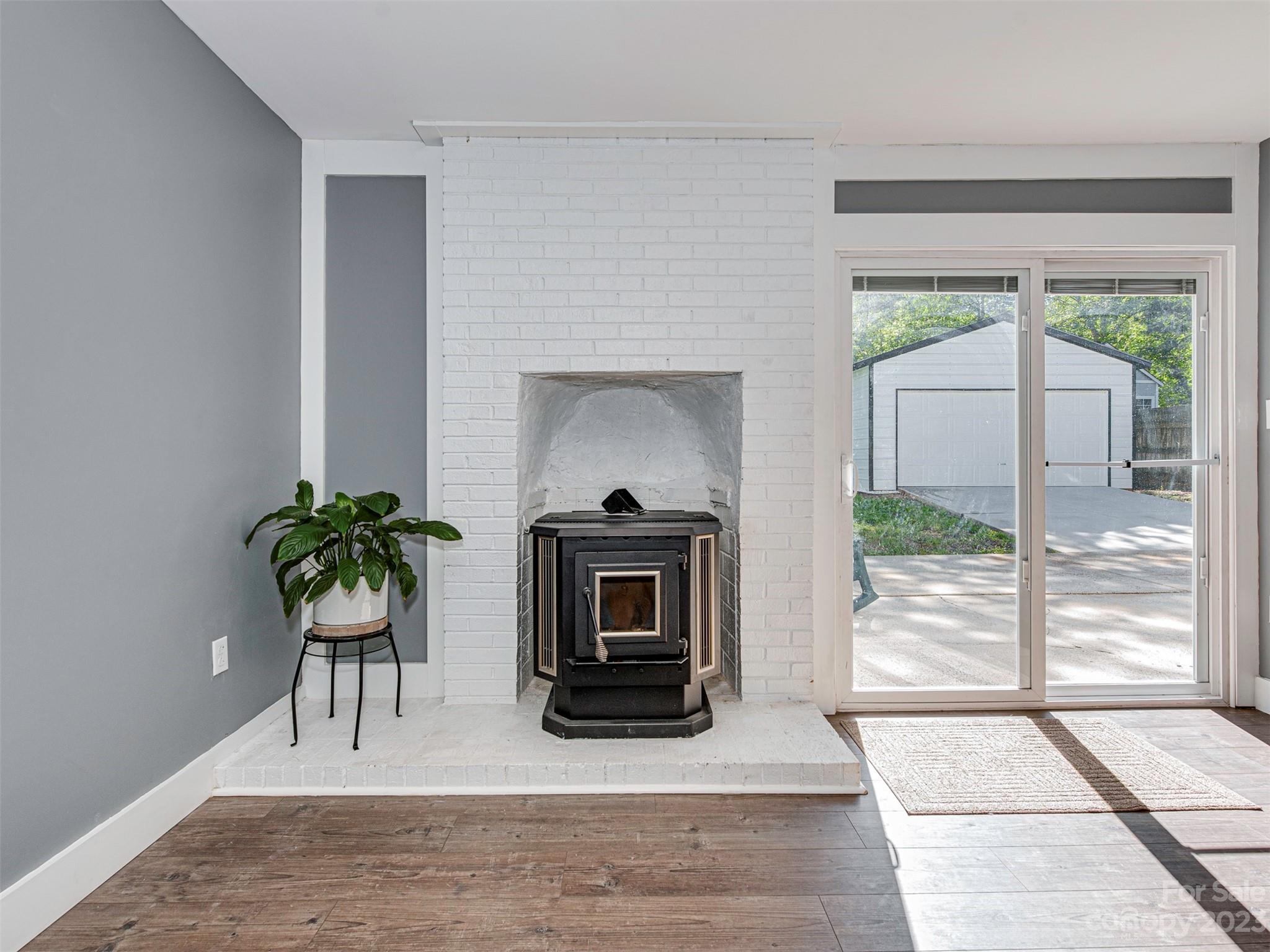9613 Watergate Road Charlotte, NC 28270 - Photo 12 of 33 a living room with a couch a fireplace and a potted plant