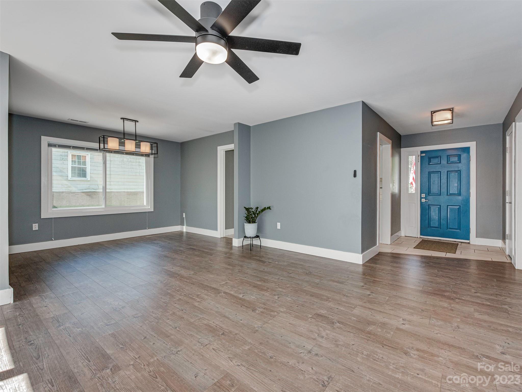 9613 Watergate Road Charlotte, NC 28270 - Photo 13 of 33 a view of an empty room with window and wooden floor