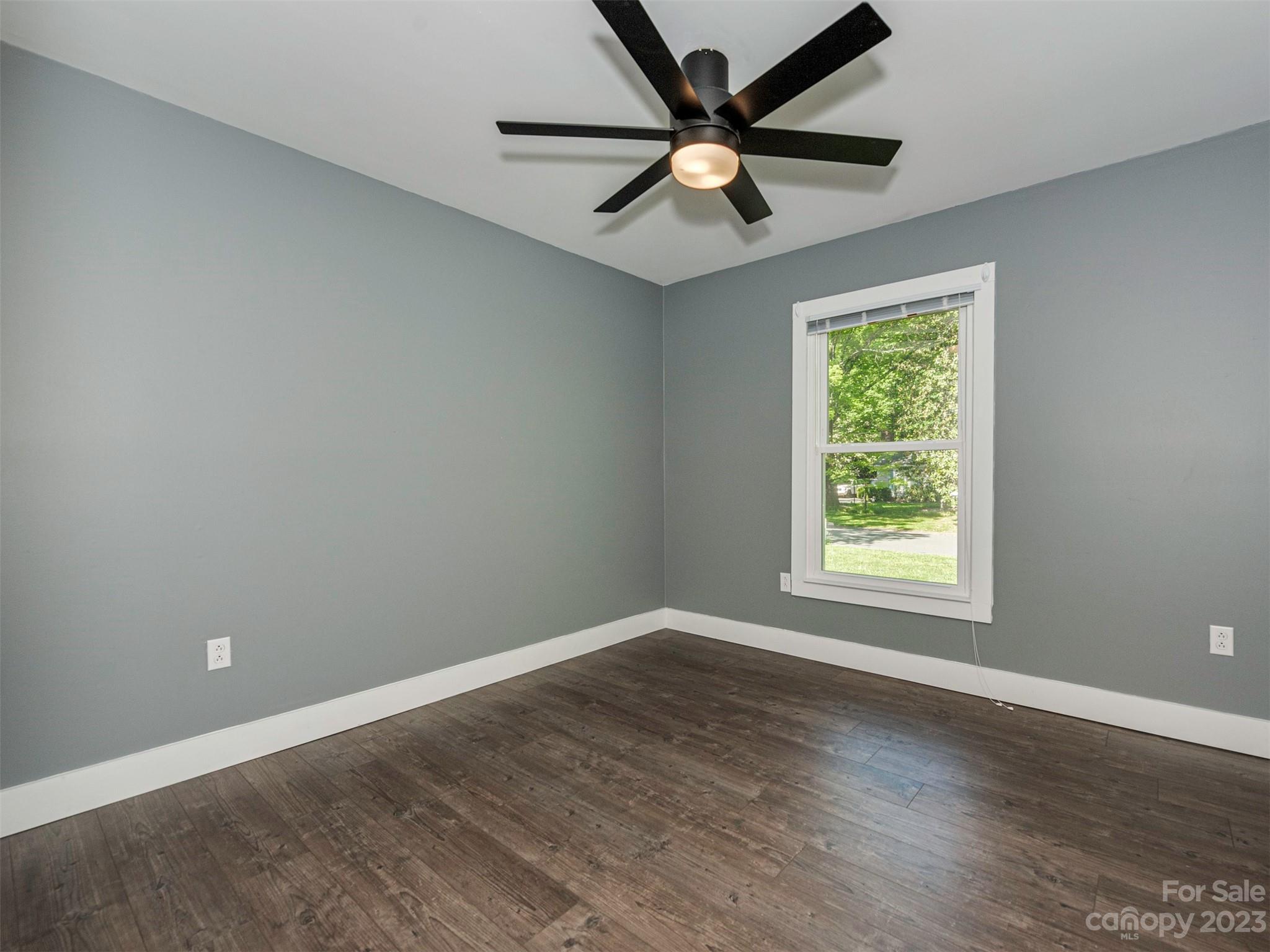 9613 Watergate Road Charlotte, NC 28270 - Photo 20 of 33 an empty room with wooden floor and windows