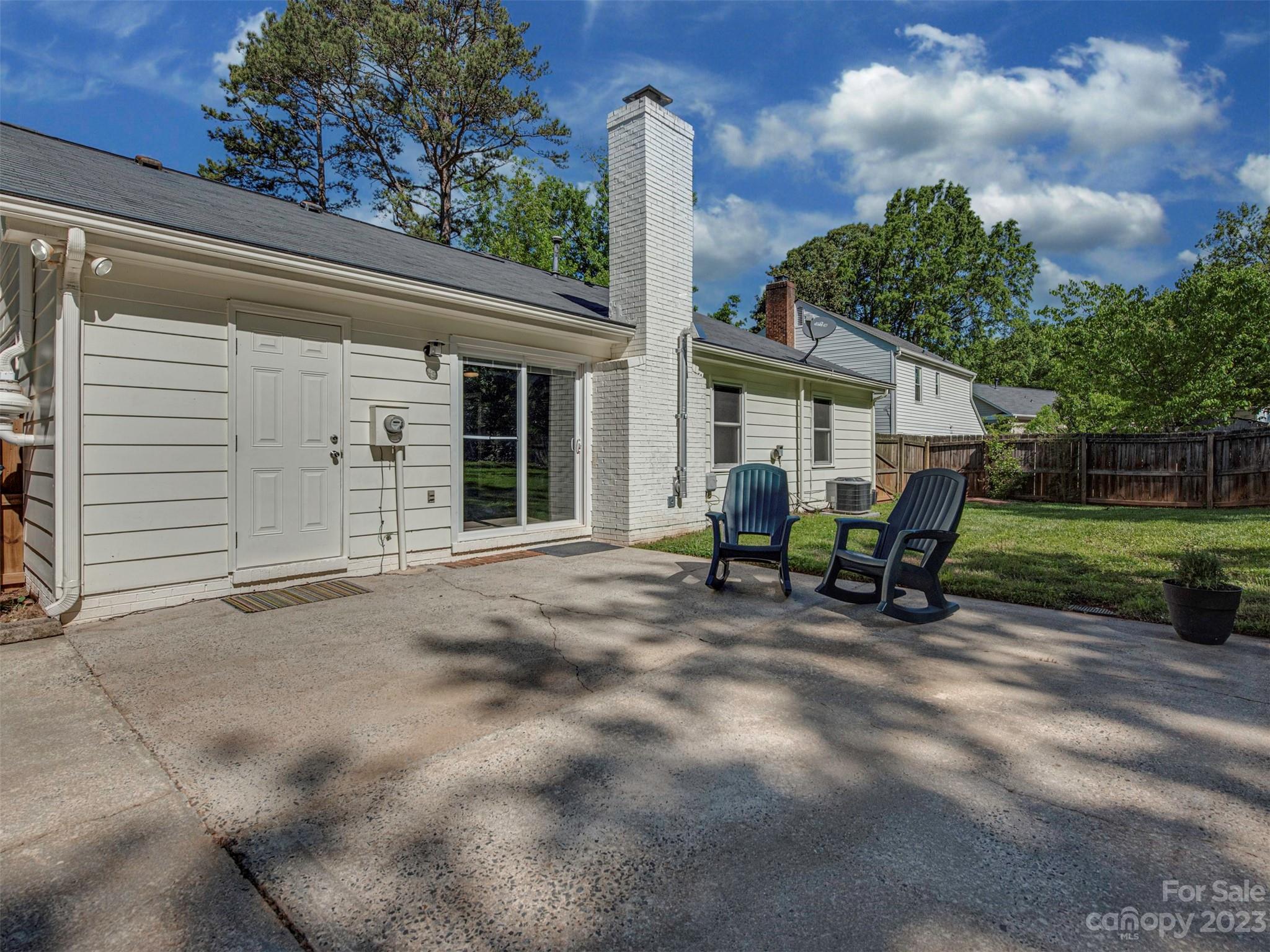9613 Watergate Road Charlotte, NC 28270 - Photo 26 of 33 a view of a house with backyard sitting area and garden