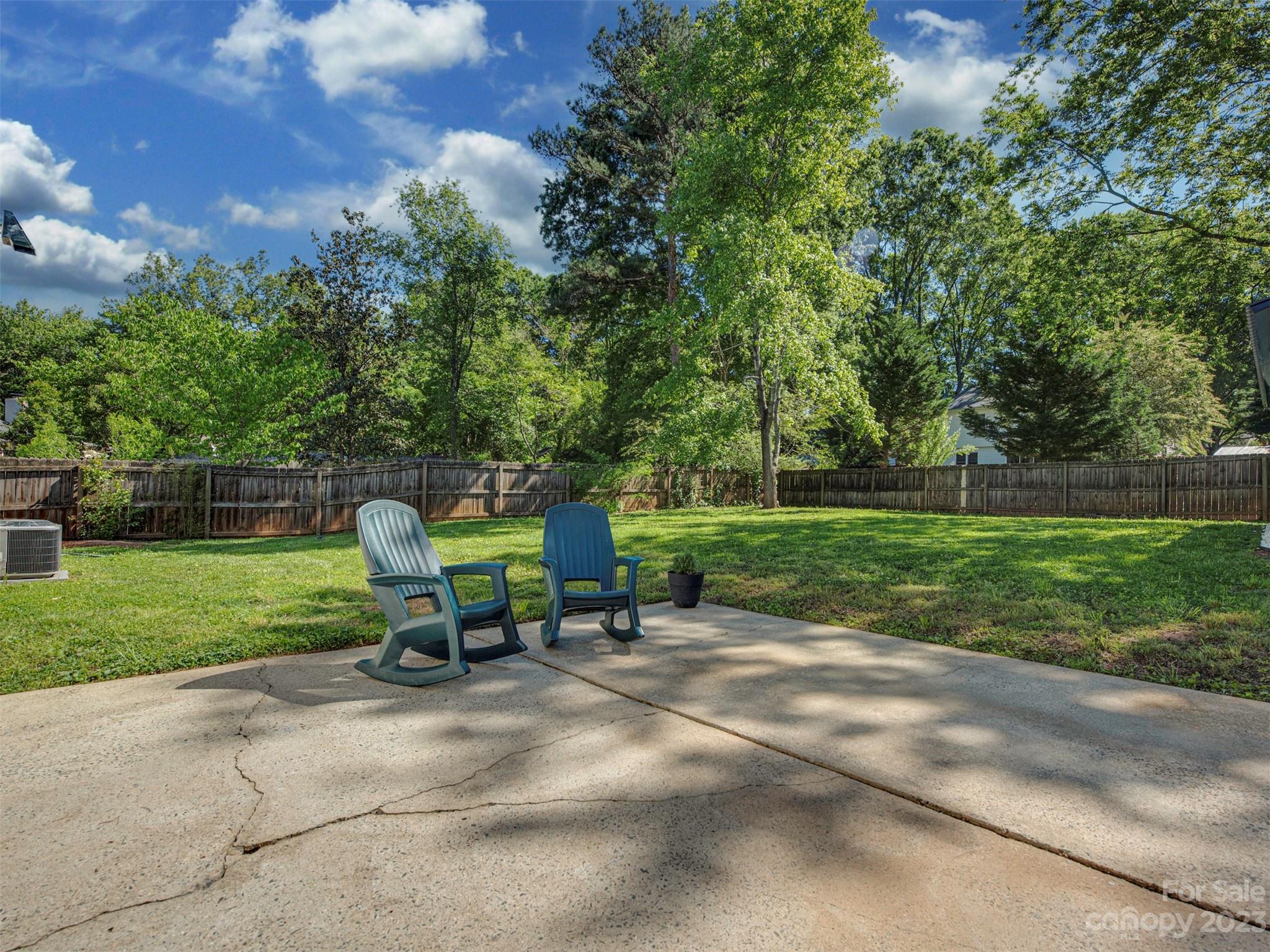 9613 Watergate Road Charlotte, NC 28270 - Photo 27 of 33 a green bench sitting in the middle of a park