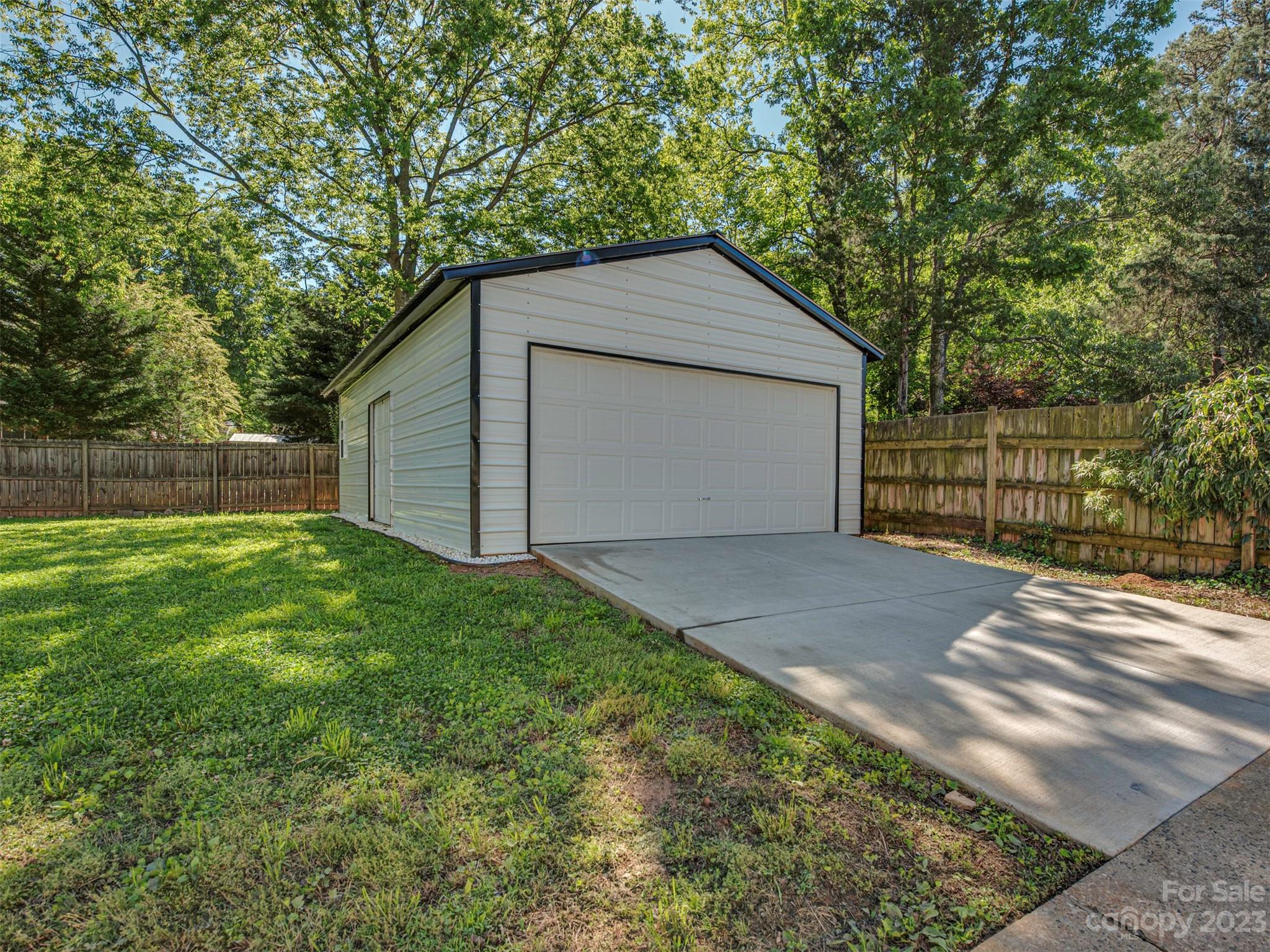9613 Watergate Road Charlotte, NC 28270 - Photo 28 of 33 a view of backyard of house with large trees