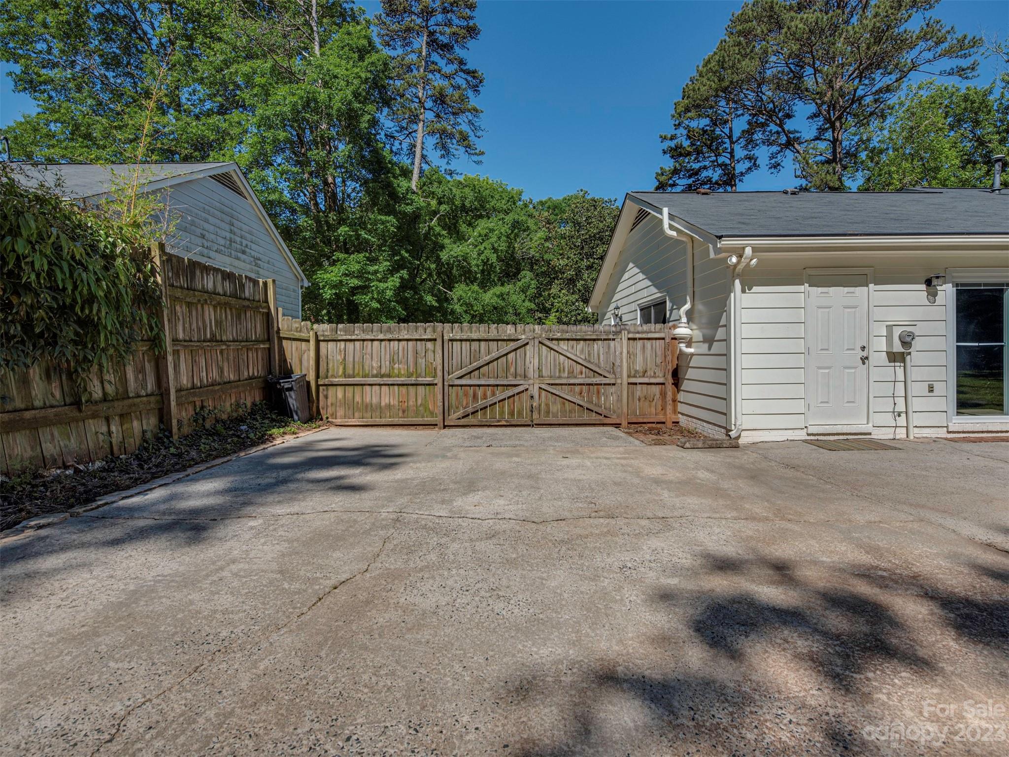 9613 Watergate Road Charlotte, NC 28270 - Photo 31 of 33 a view of backyard and tree