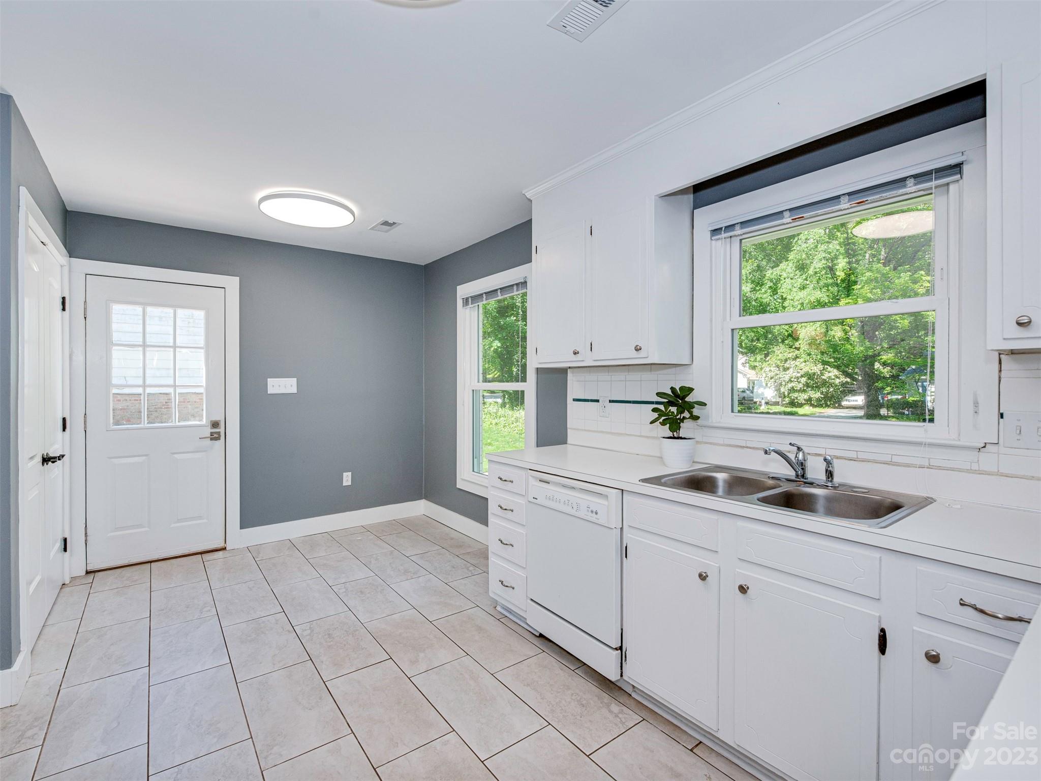 9613 Watergate Road Charlotte, NC 28270 - Photo 5 of 33 a kitchen with a sink and cabinets