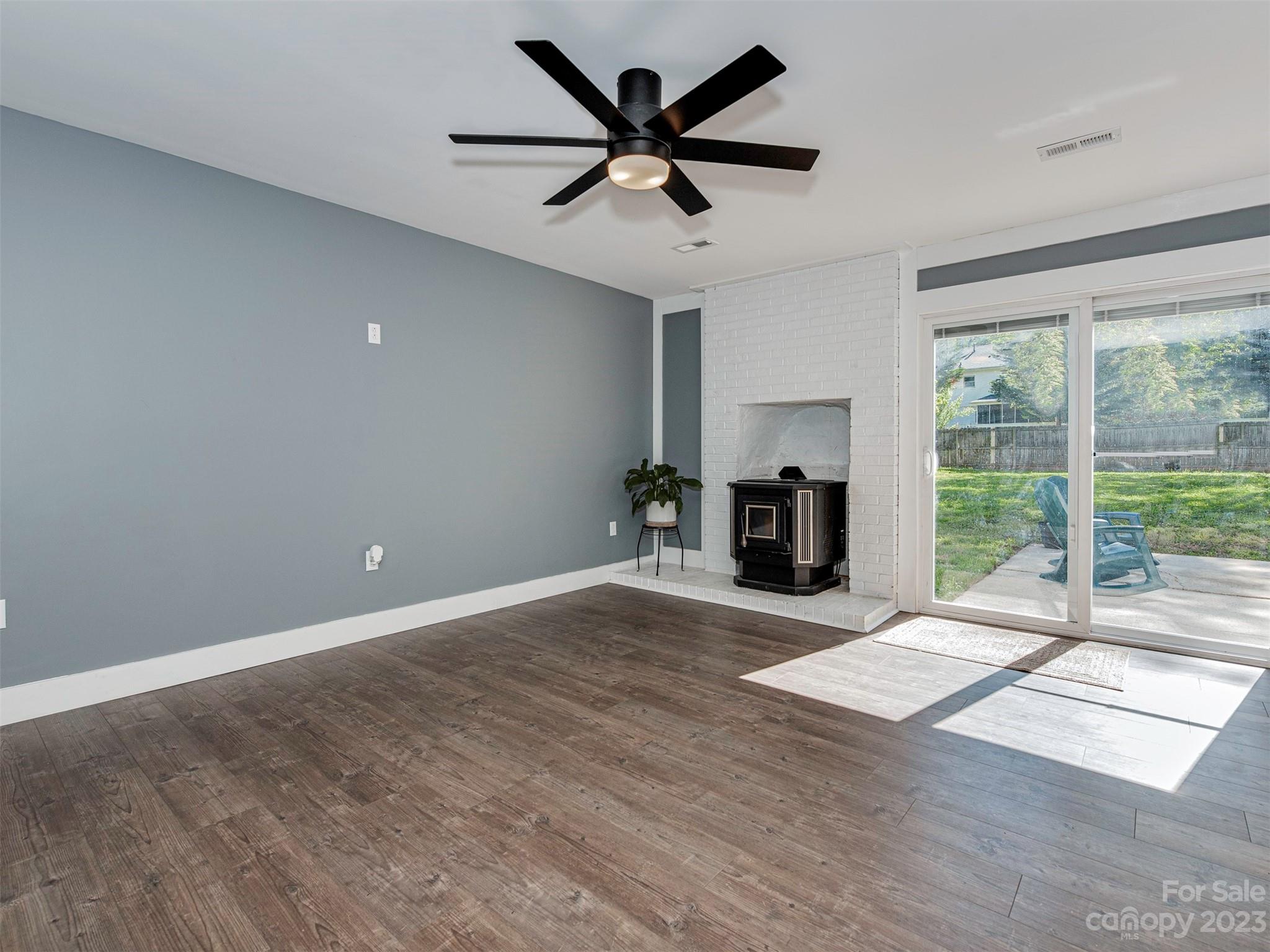 9613 Watergate Road Charlotte, NC 28270 - Photo 10 of 33 a view of an empty room with a fireplace and a window
