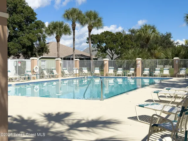 a view of swimming pool with a patio