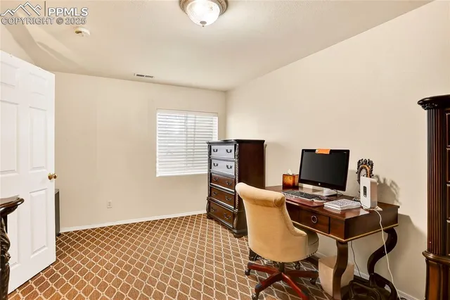 a view of a workspace with furniture