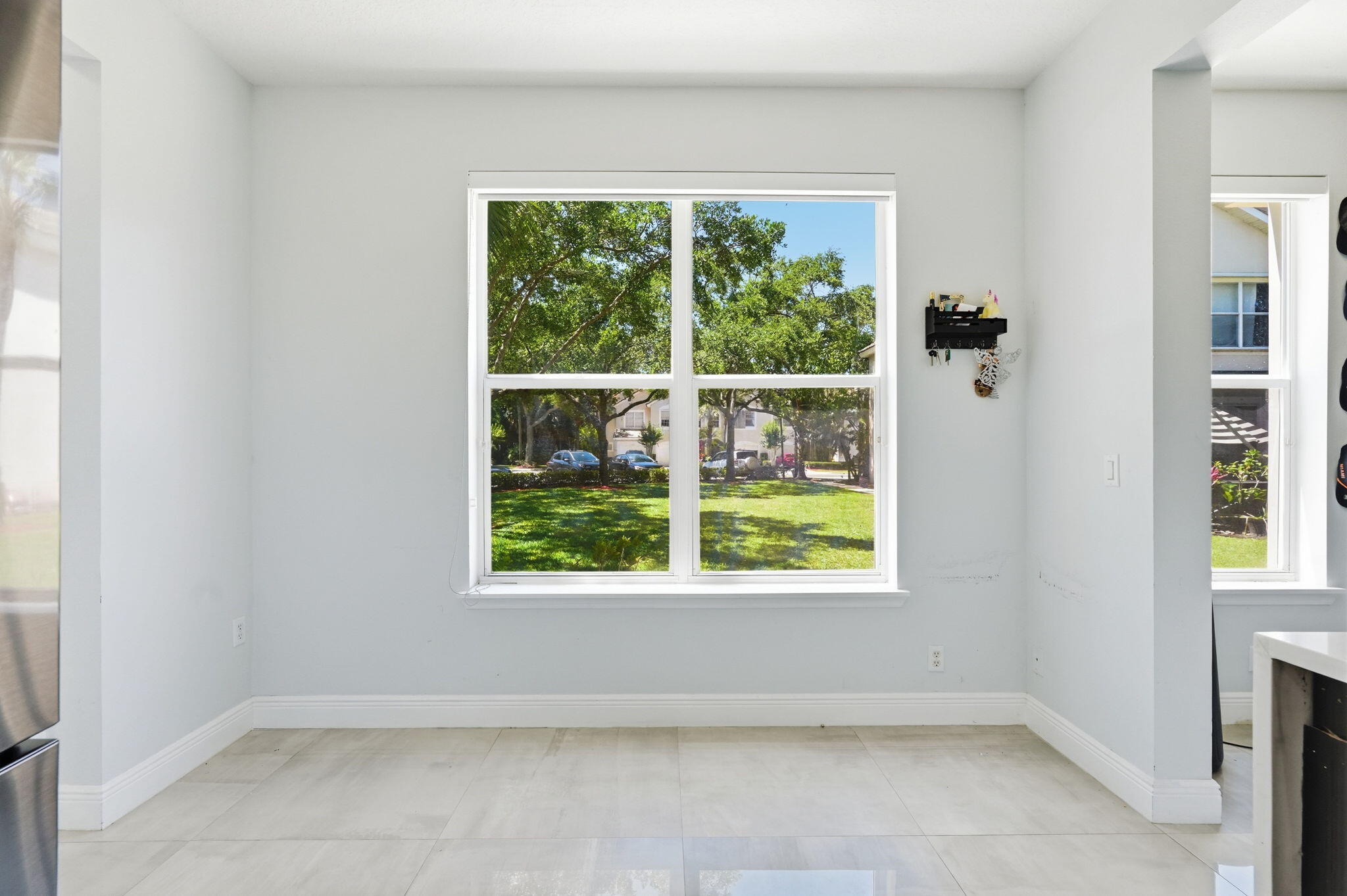 1086 Woodfield Road Greenacres, FL 33415 - Photo 11 of 32 an empty room with windows