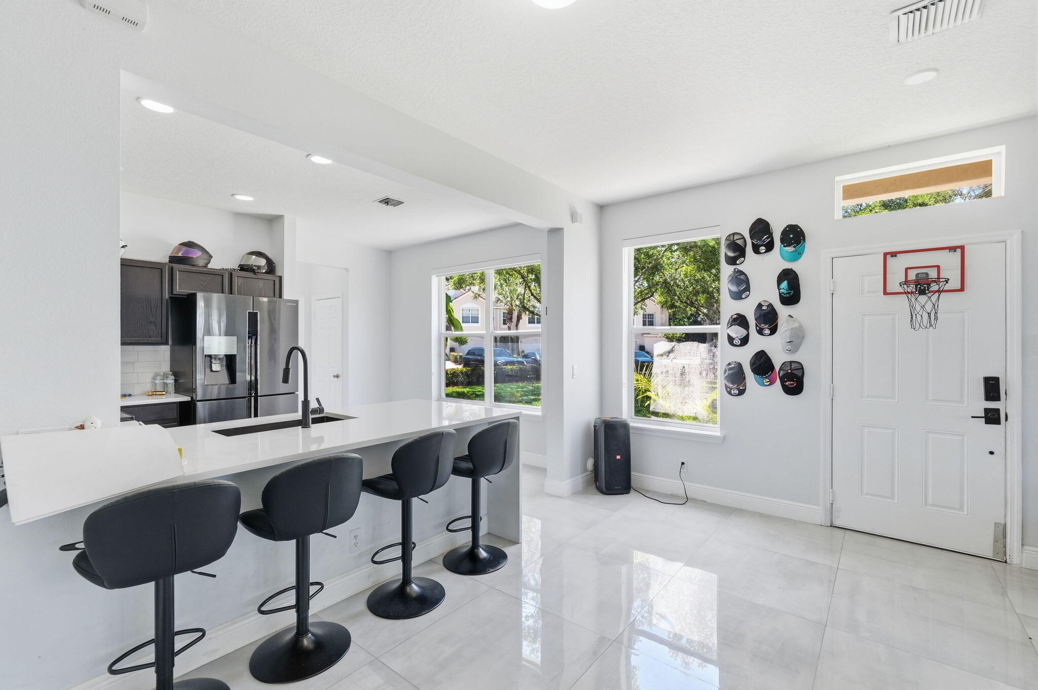 1086 Woodfield Road Greenacres, FL 33415 - Photo 12 of 32 a view of a livingroom with furniture and window