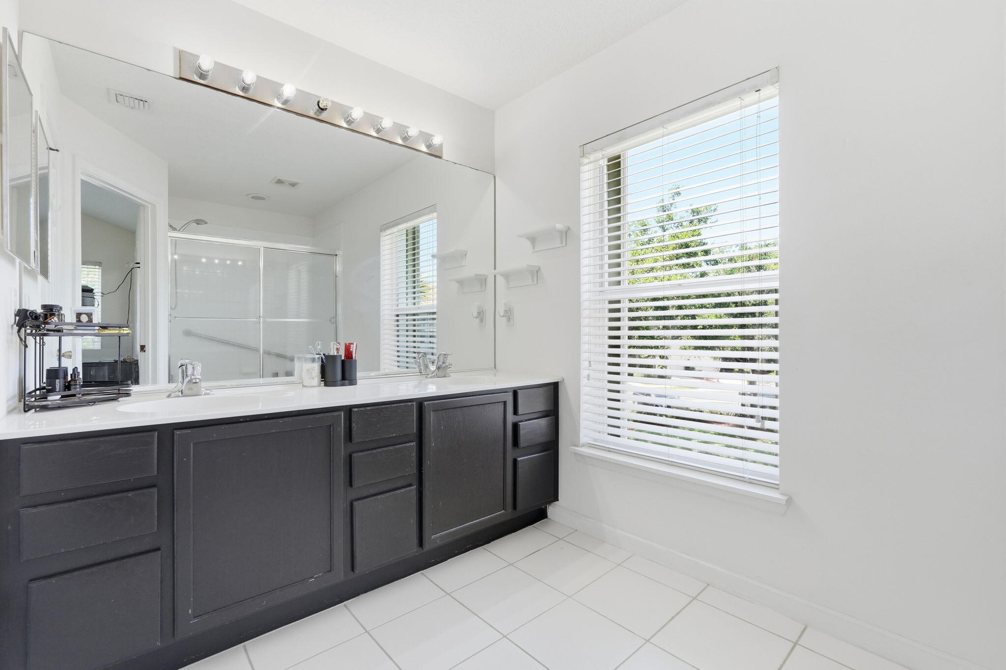 1086 Woodfield Road Greenacres, FL 33415 - Photo 17 of 32 a kitchen with a sink and cabinets
