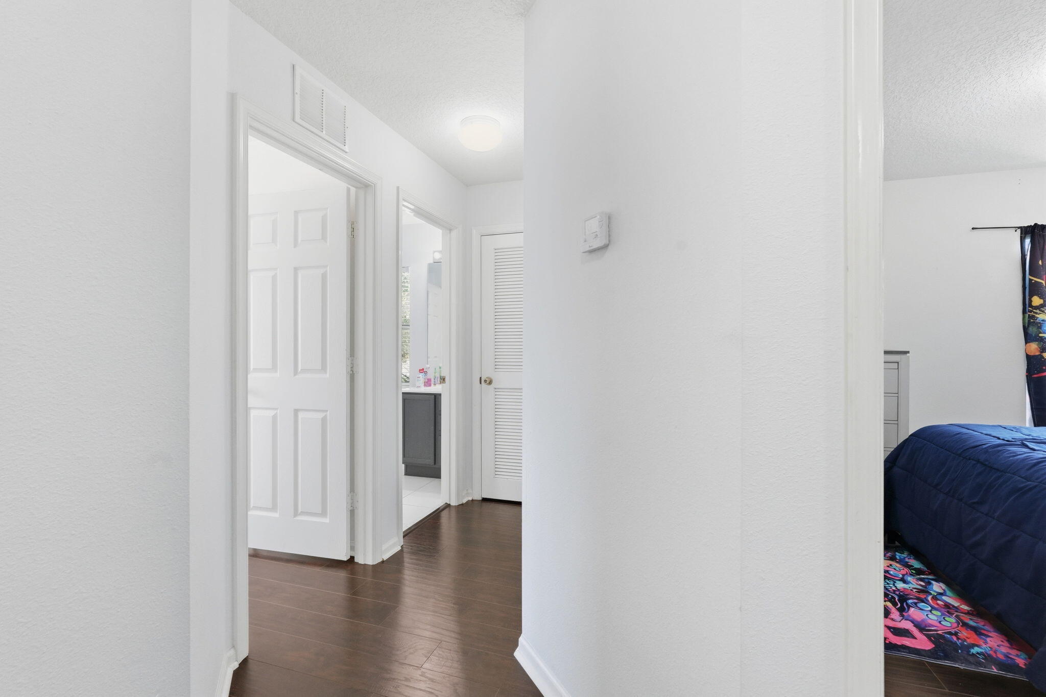 1086 Woodfield Road Greenacres, FL 33415 - Photo 24 of 32 a view of a hallway with wooden floor