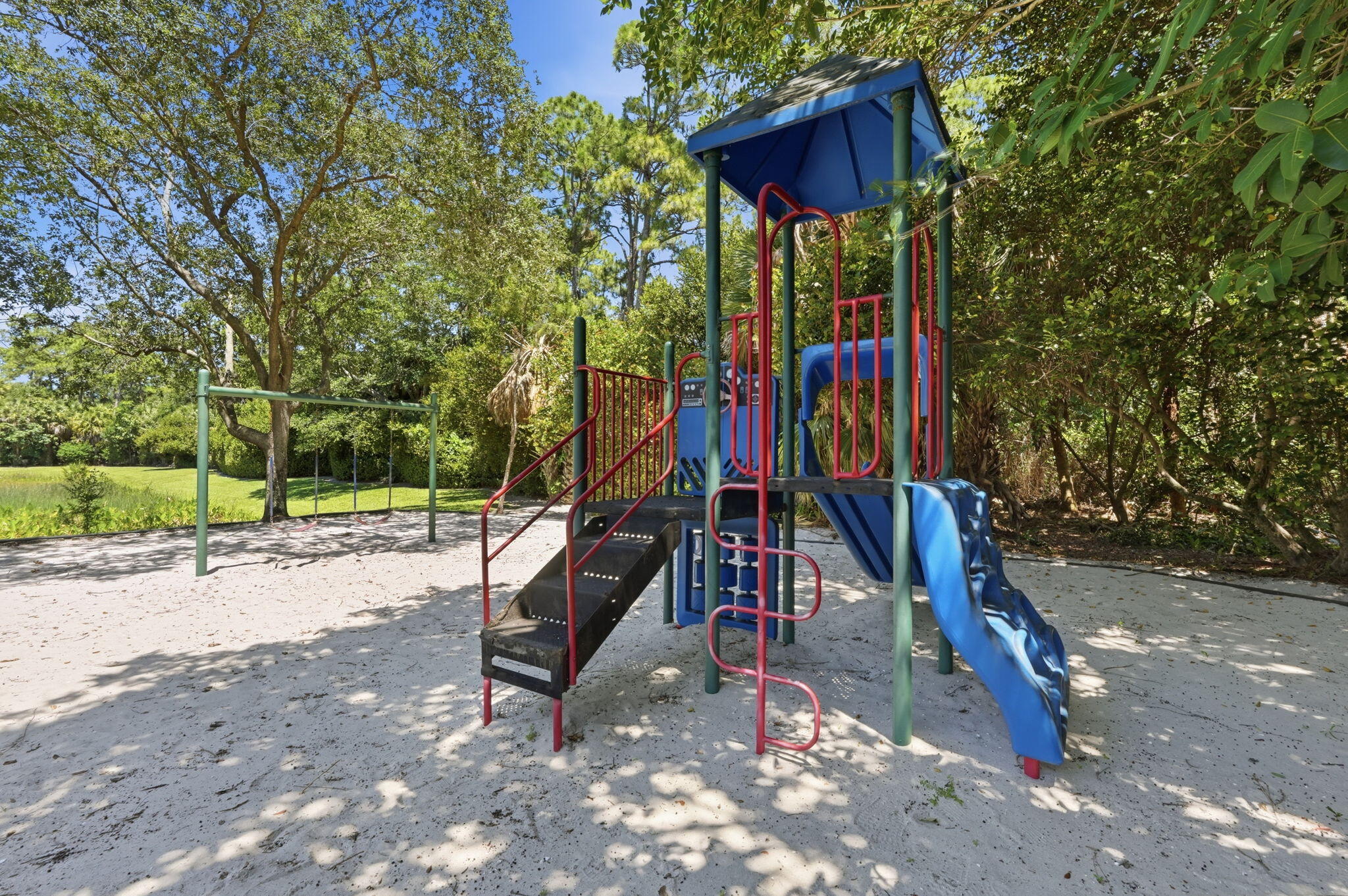 1086 Woodfield Road Greenacres, FL 33415 - Photo 31 of 32 a view of a park with slide