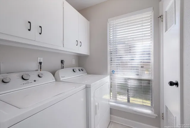 a view of small house with wooden fence