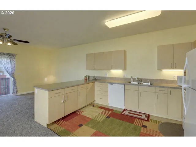 a kitchen with white cabinets