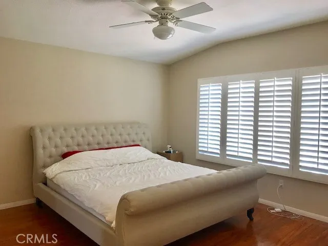 a bedroom with a bed and window