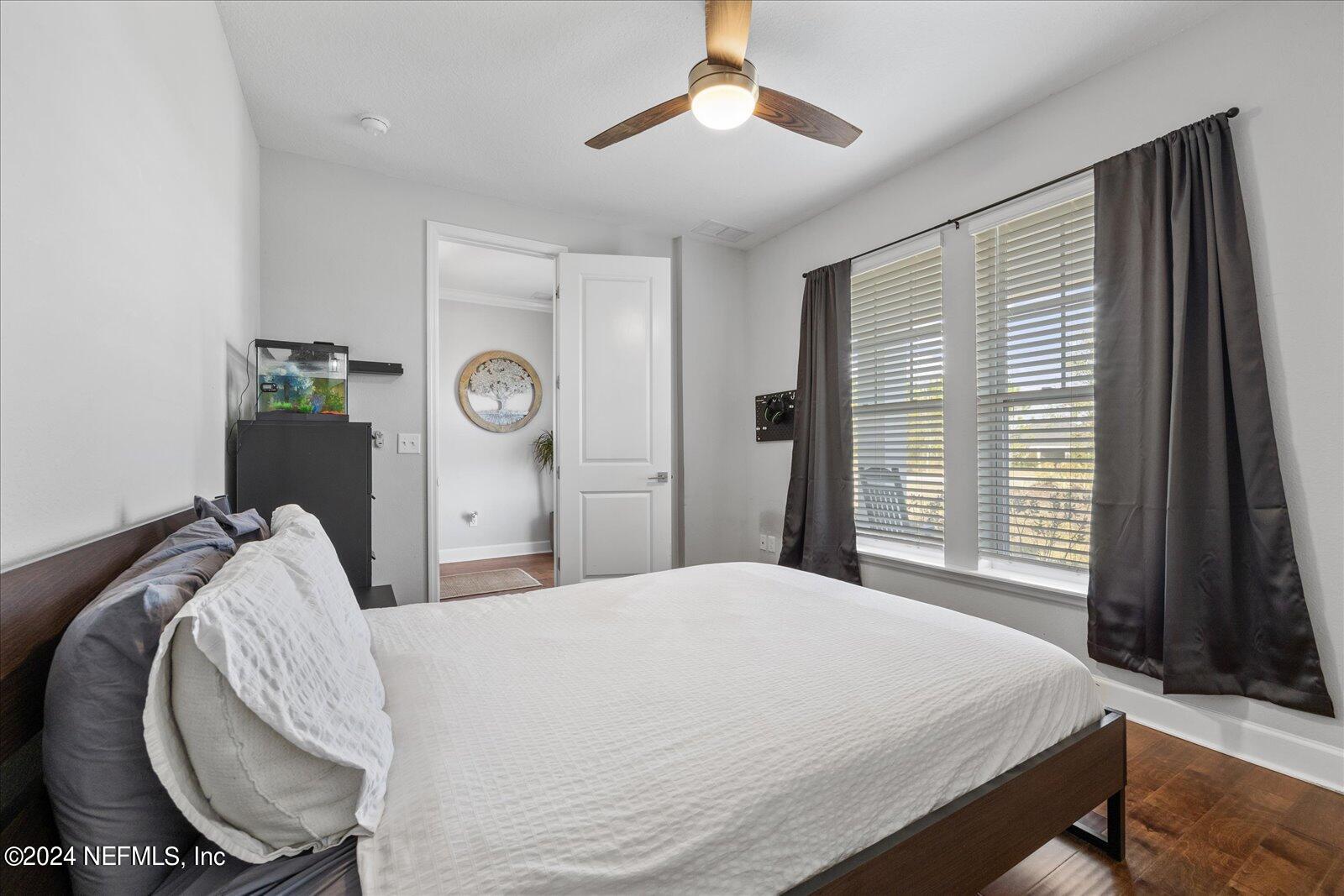 196 Ashbury Street St. Augustine, FL 32092 - Photo 11 of 35 a bedroom with a bed and a chandelier