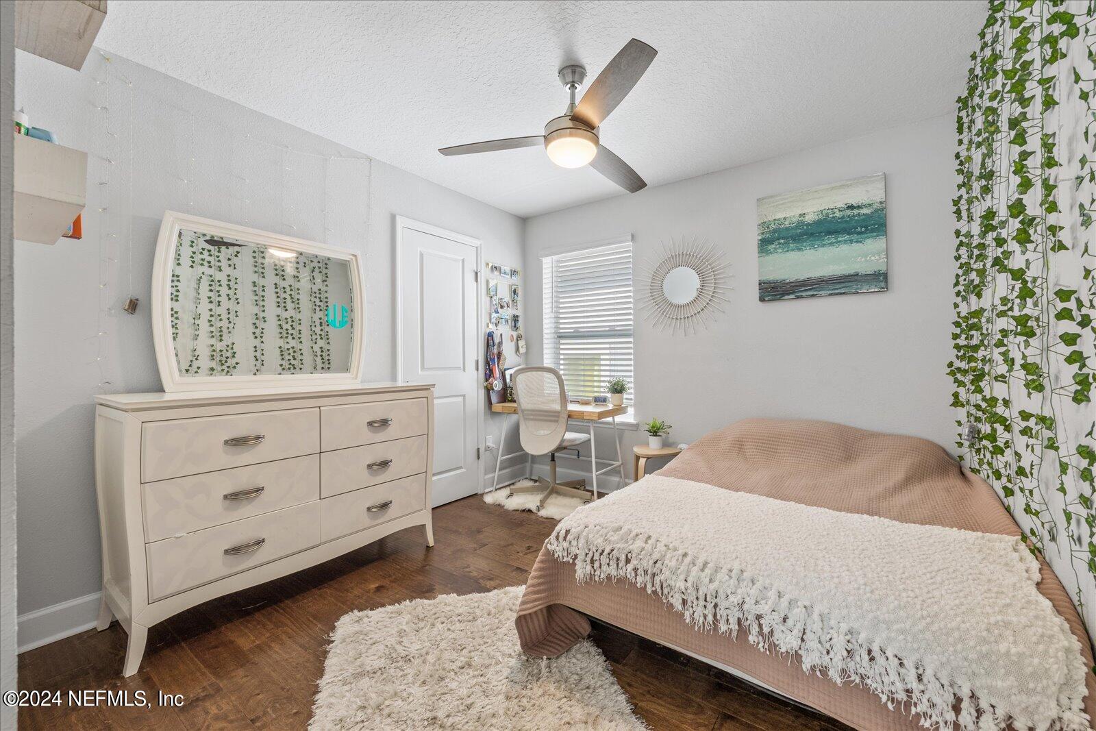 196 Ashbury Street St. Augustine, FL 32092 - Photo 15 of 35 a bedroom with a bed and a dresser