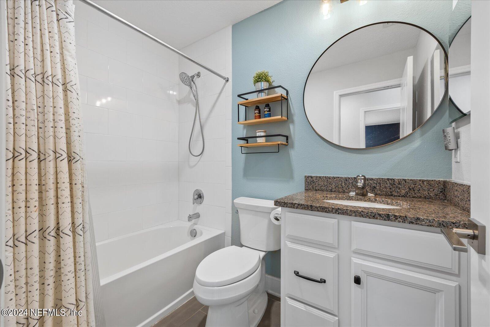 196 Ashbury Street St. Augustine, FL 32092 - Photo 16 of 35 a bathroom with a sink toilet and shower