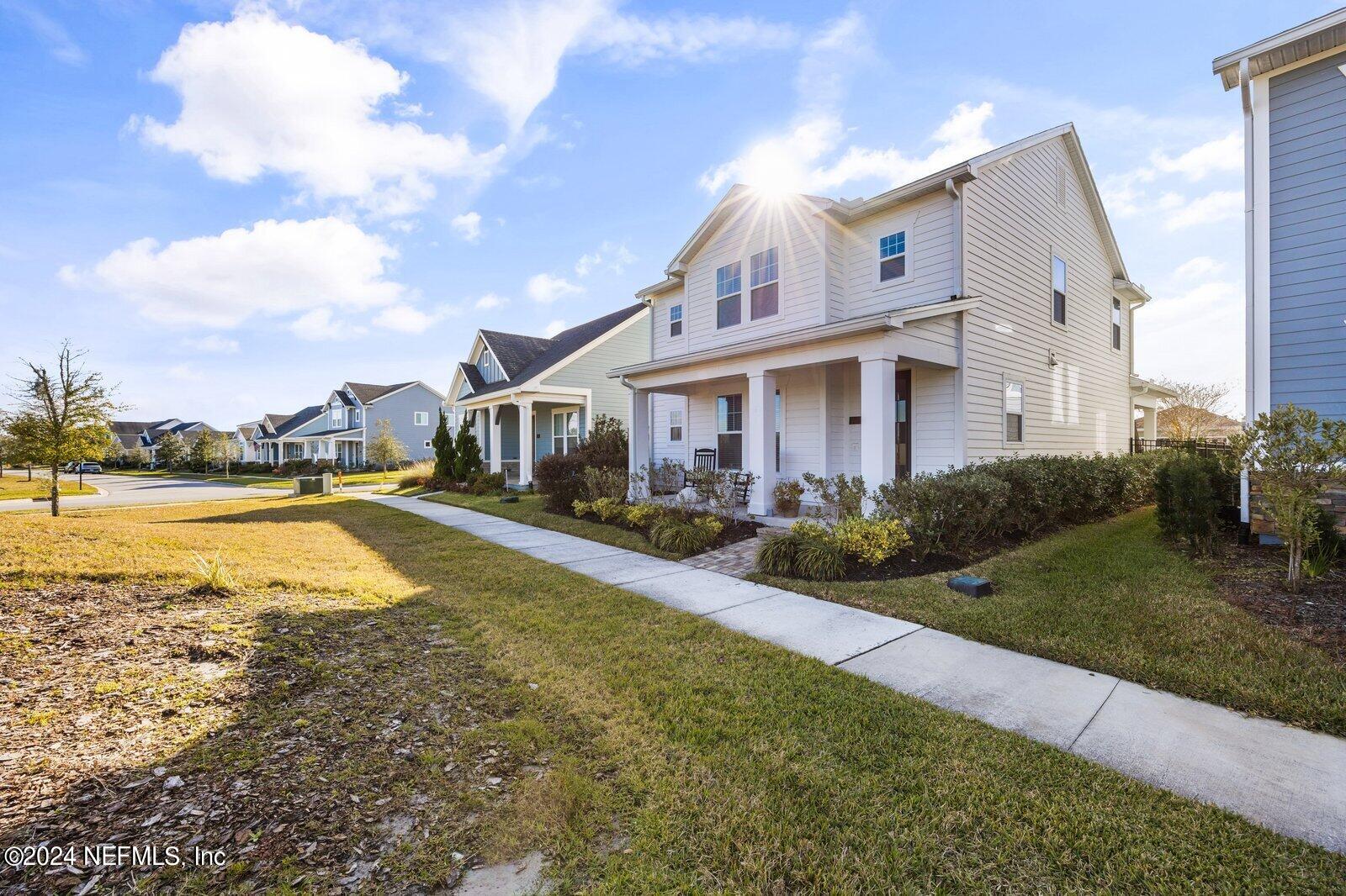 196 Ashbury Street St. Augustine, FL 32092 - Photo 2 of 35 a view of a house with swimming pool and a yard