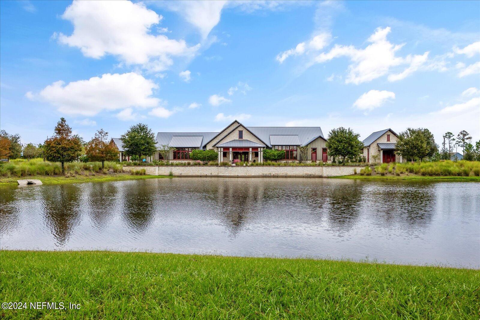 196 Ashbury Street St. Augustine, FL 32092 - Photo 27 of 35 a view of a lake with houses in the background