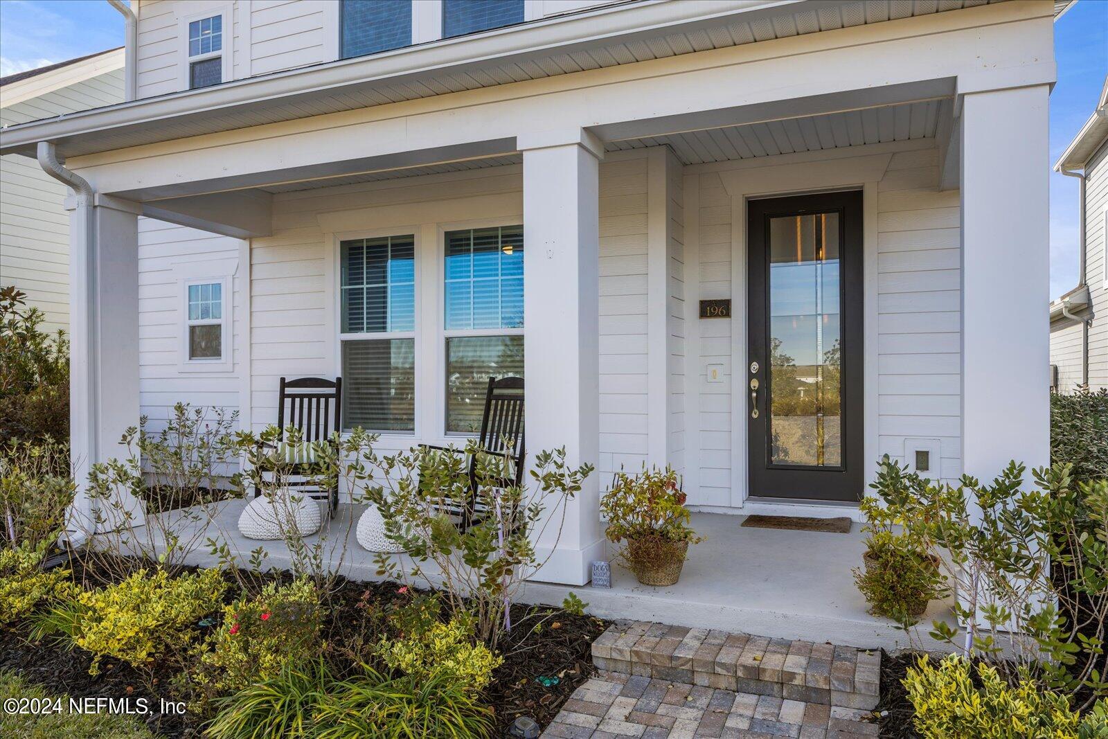 196 Ashbury Street St. Augustine, FL 32092 - Photo 3 of 35 a front view of a house with a porch