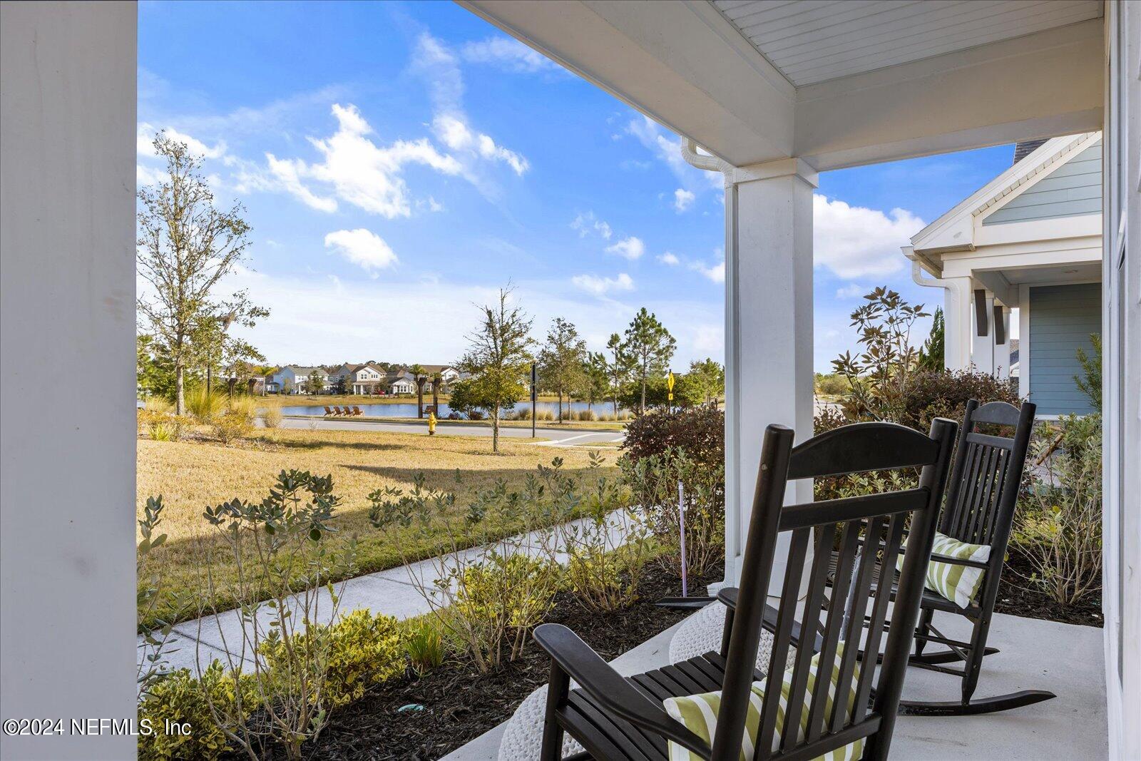 196 Ashbury Street St. Augustine, FL 32092 - Photo 4 of 35 a view of a balcony with chair and table