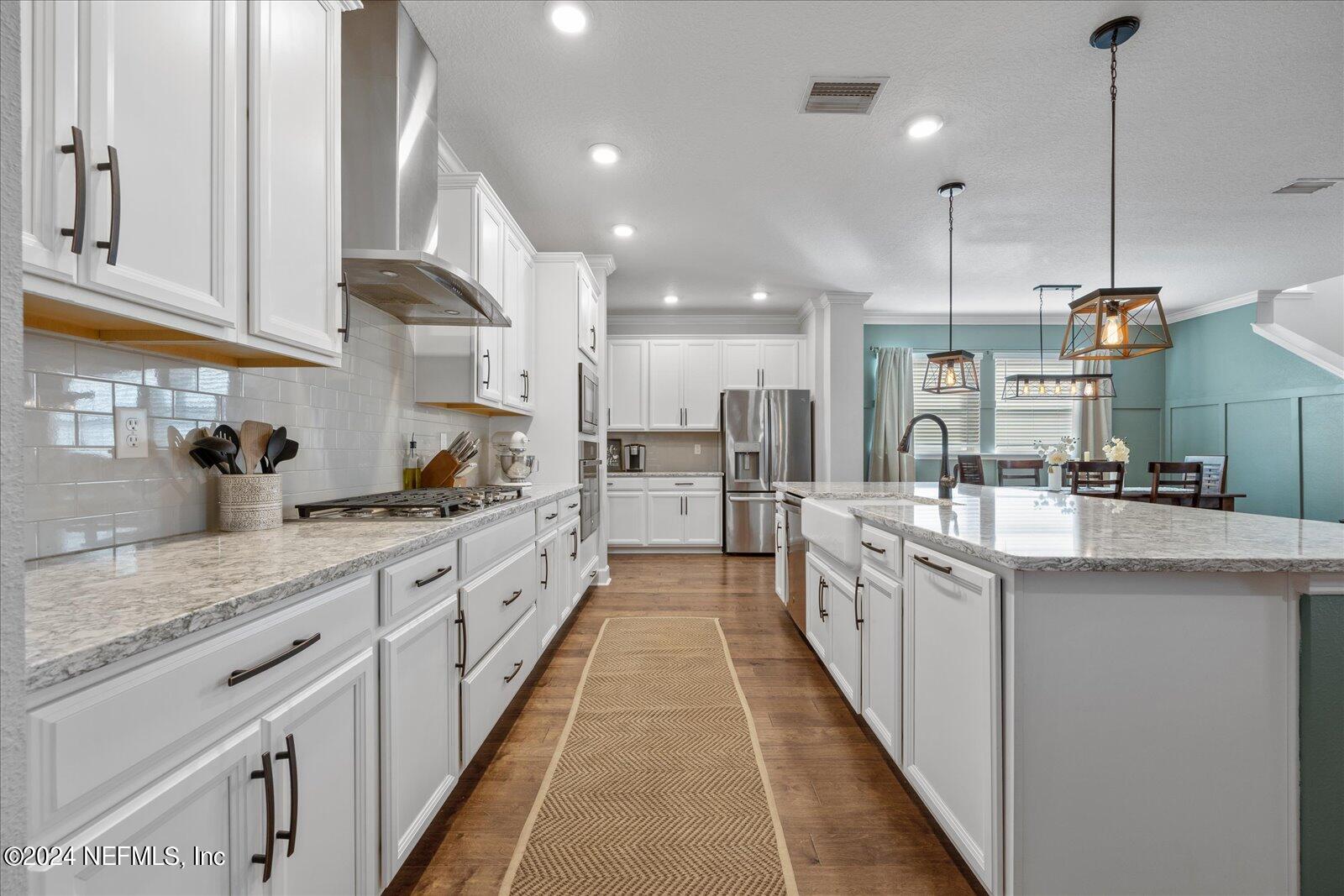 196 Ashbury Street St. Augustine, FL 32092 - Photo 5 of 35 a large kitchen with stainless steel appliances lots of counter space sink and cabinets