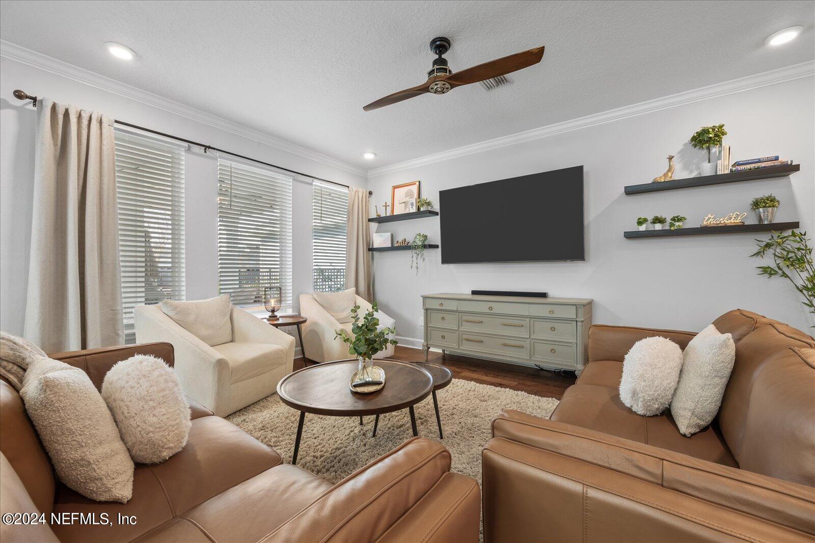 196 Ashbury Street St. Augustine, FL 32092 - Photo 6 of 35 a living room with furniture and a flat screen tv