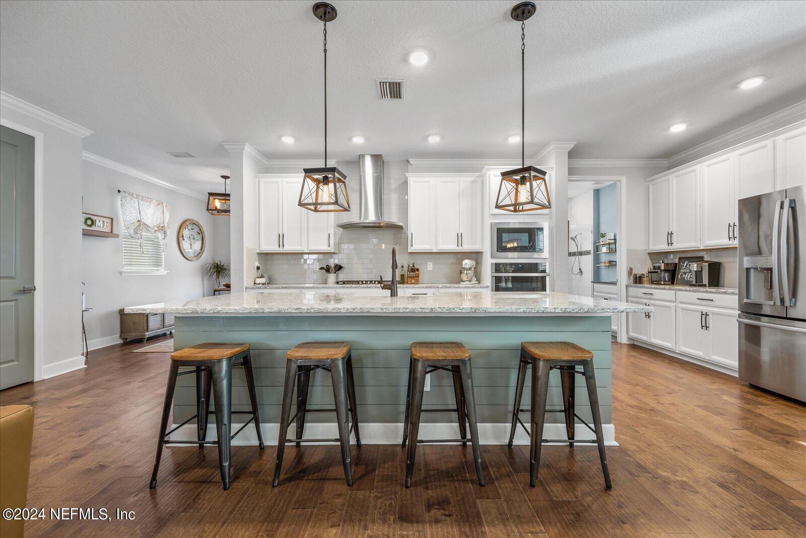 196 Ashbury Street St. Augustine, FL 32092 - Photo 8 of 35 a large kitchen with granite countertop lots of counter space and refrigerator