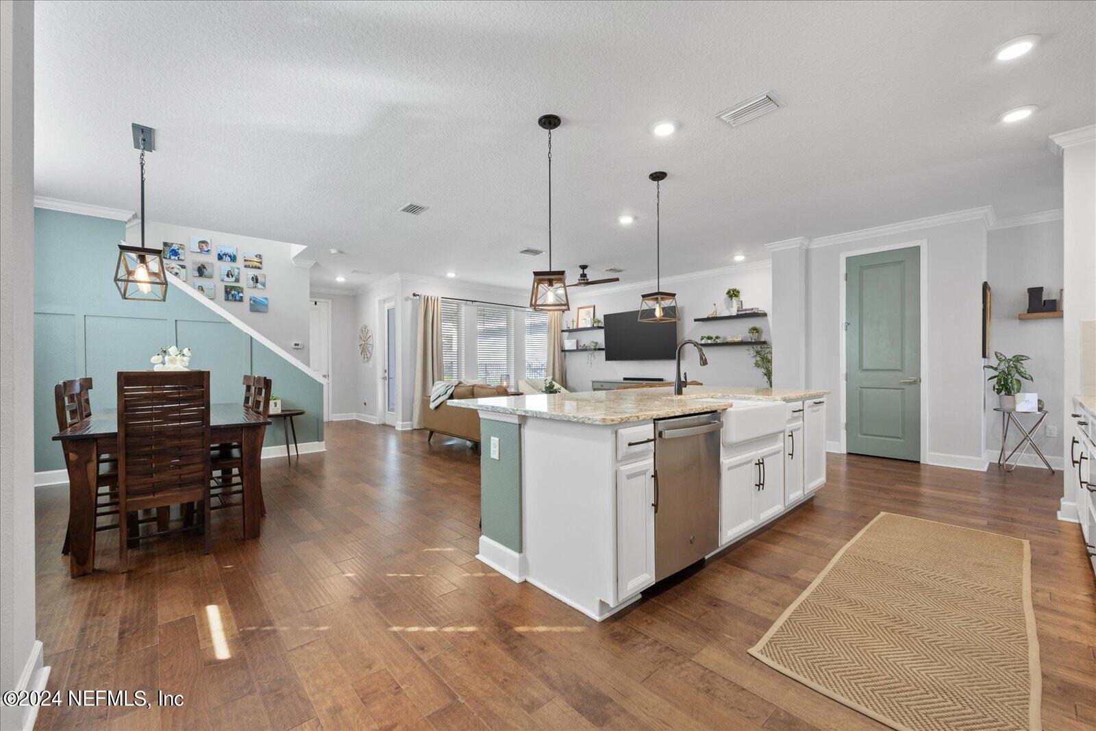 196 Ashbury Street St. Augustine, FL 32092 - Photo 9 of 35 a kitchen that has a lot of cabinets in it and appliances