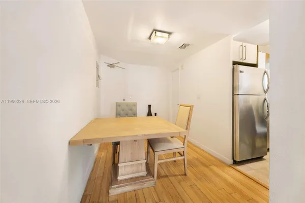 a kitchen with a stove and a refrigerator