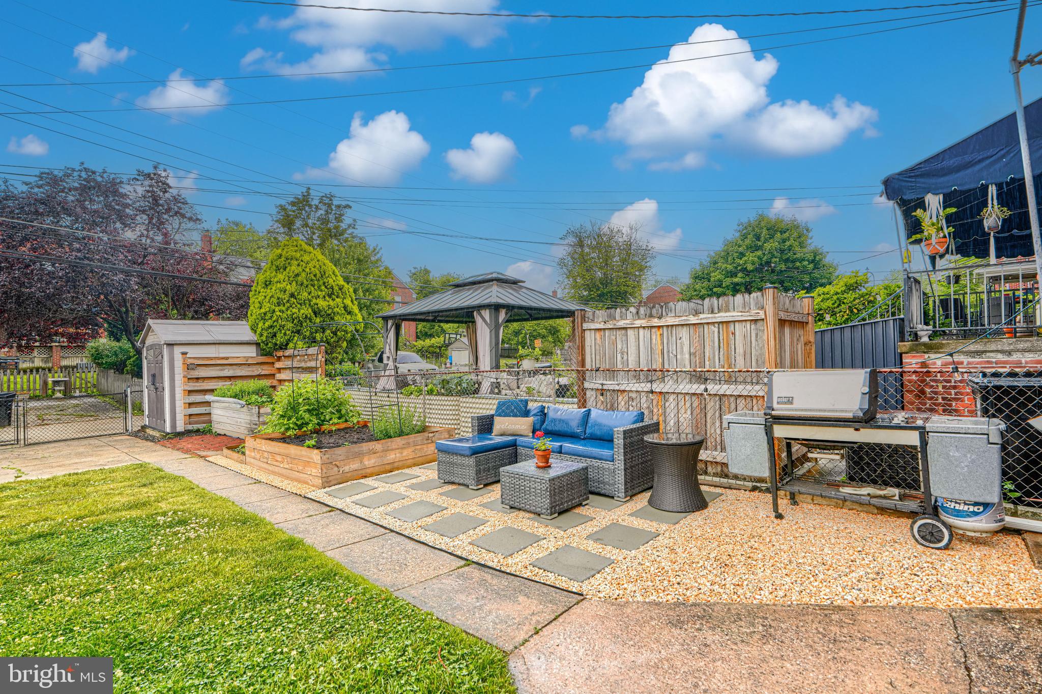 8132 Pleasant Plains Road Towson, MD 21286 - Photo 46 of 55 a view of a patio with couches table and chairs and potted plants
