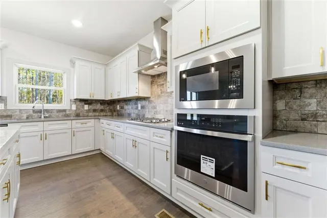 a bathroom with a sink toilet and mirror