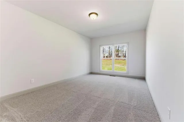 a view of an empty room with a closet