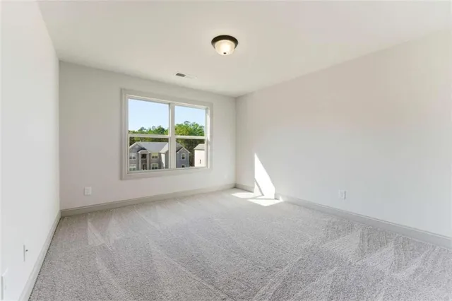a bathroom with a sink a toilet and a large mirror