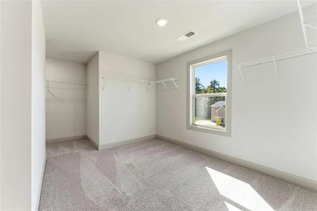 a view of a livingroom with a window and a fireplace