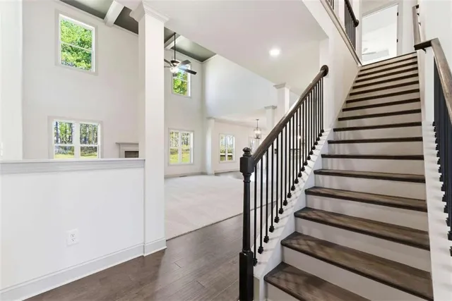 a view of entryway with stairs and wooden floor