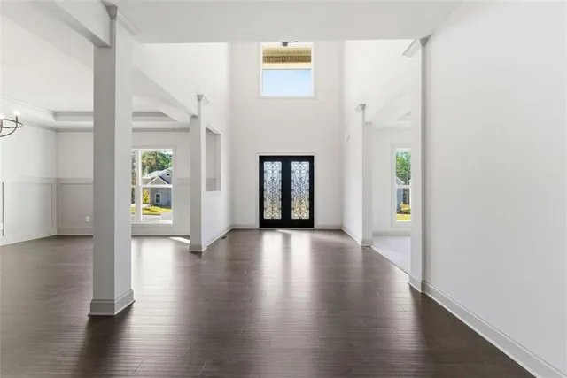 a view of an entryway with wooden floor