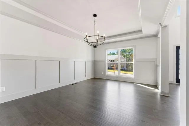 a view of livingroom with window wooden floor and brick wall
