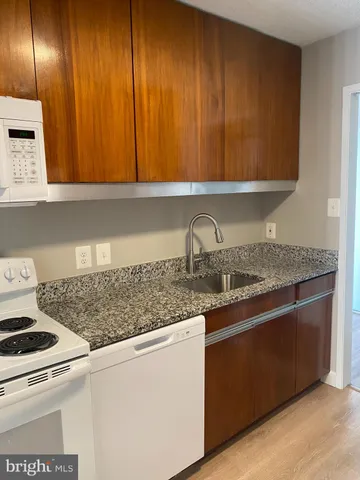 a close view of stove and microwave