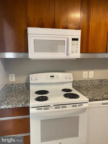 a white refrigerator freezer sitting in a kitchen