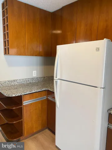 a view of room with wooden floor