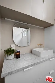 a bathroom with a shower and a window