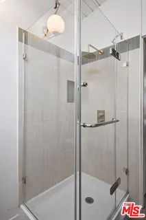 a view of a patio with table and chairs and potted plants