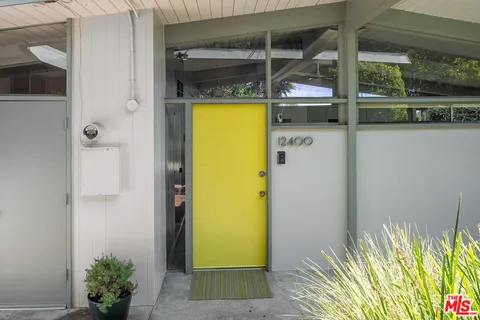 a view of a hallway with a room