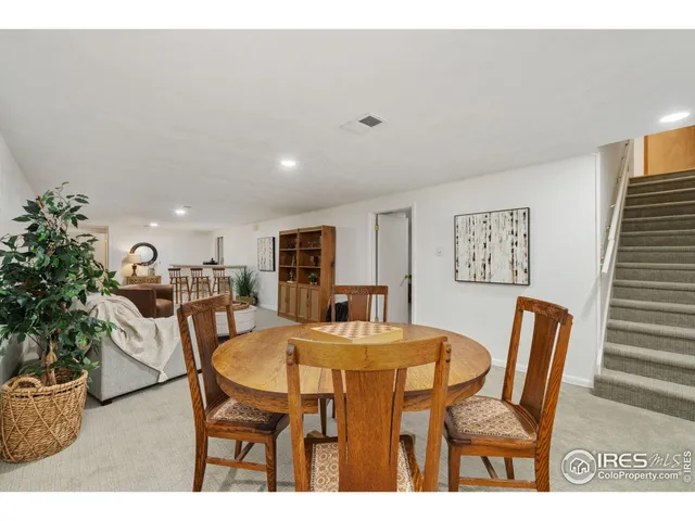 a dining room with furniture and window