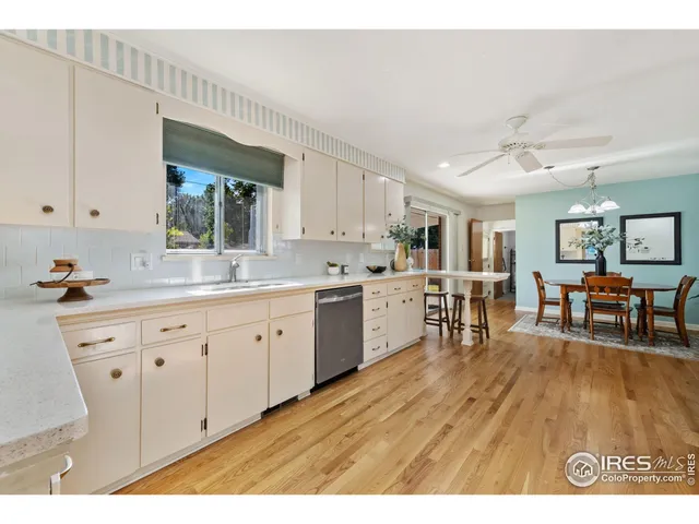 a open kitchen with cabinets a sink and appliances