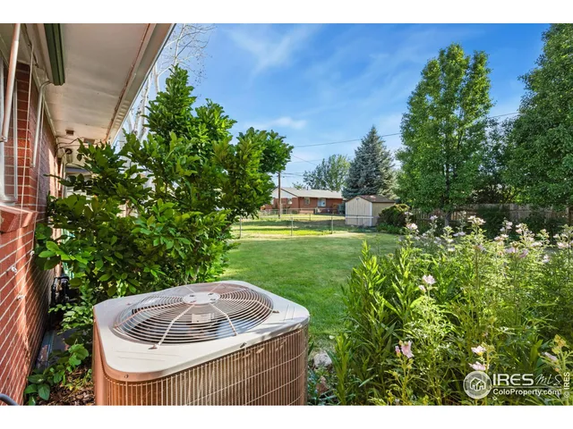 a view of a backyard with a fountain