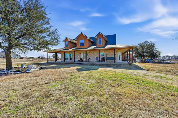 a front view of a house with swimming pool